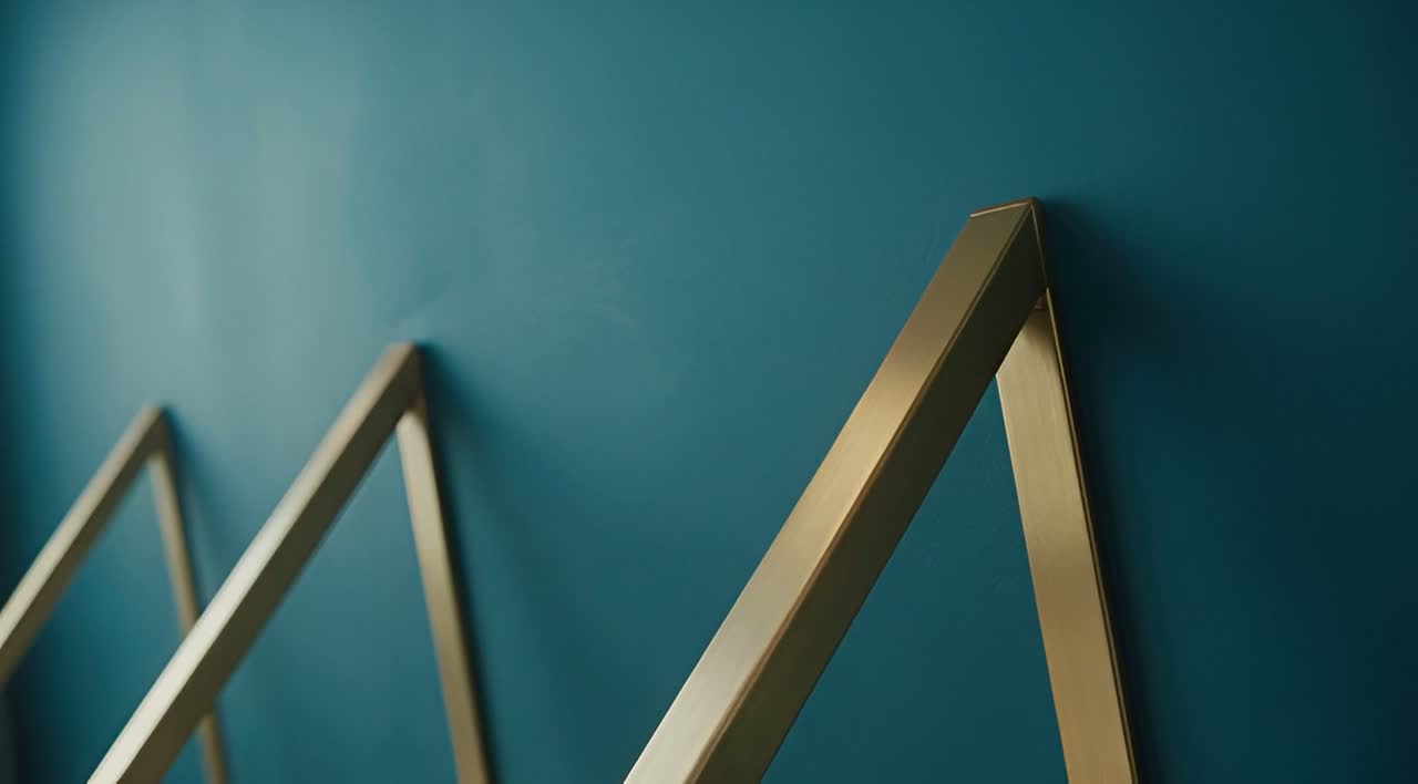 Brass braces leaning against a teal wall.